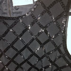 Sleeveless sequined top.